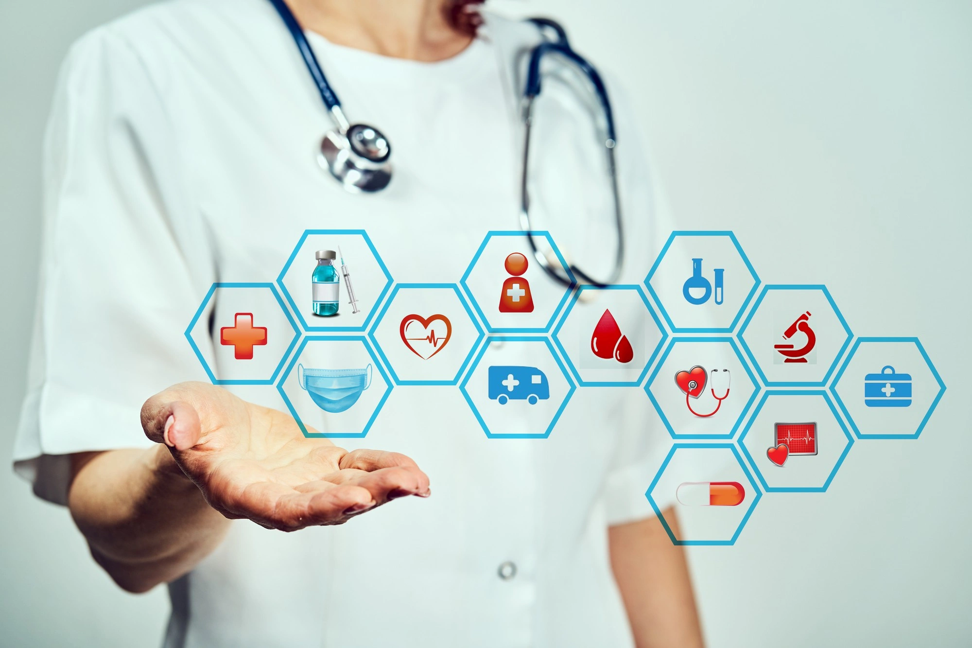 Doctor pointing at a digital diagram showing human body systems, including lungs, brain, heart, kidneys, bones, and intestines